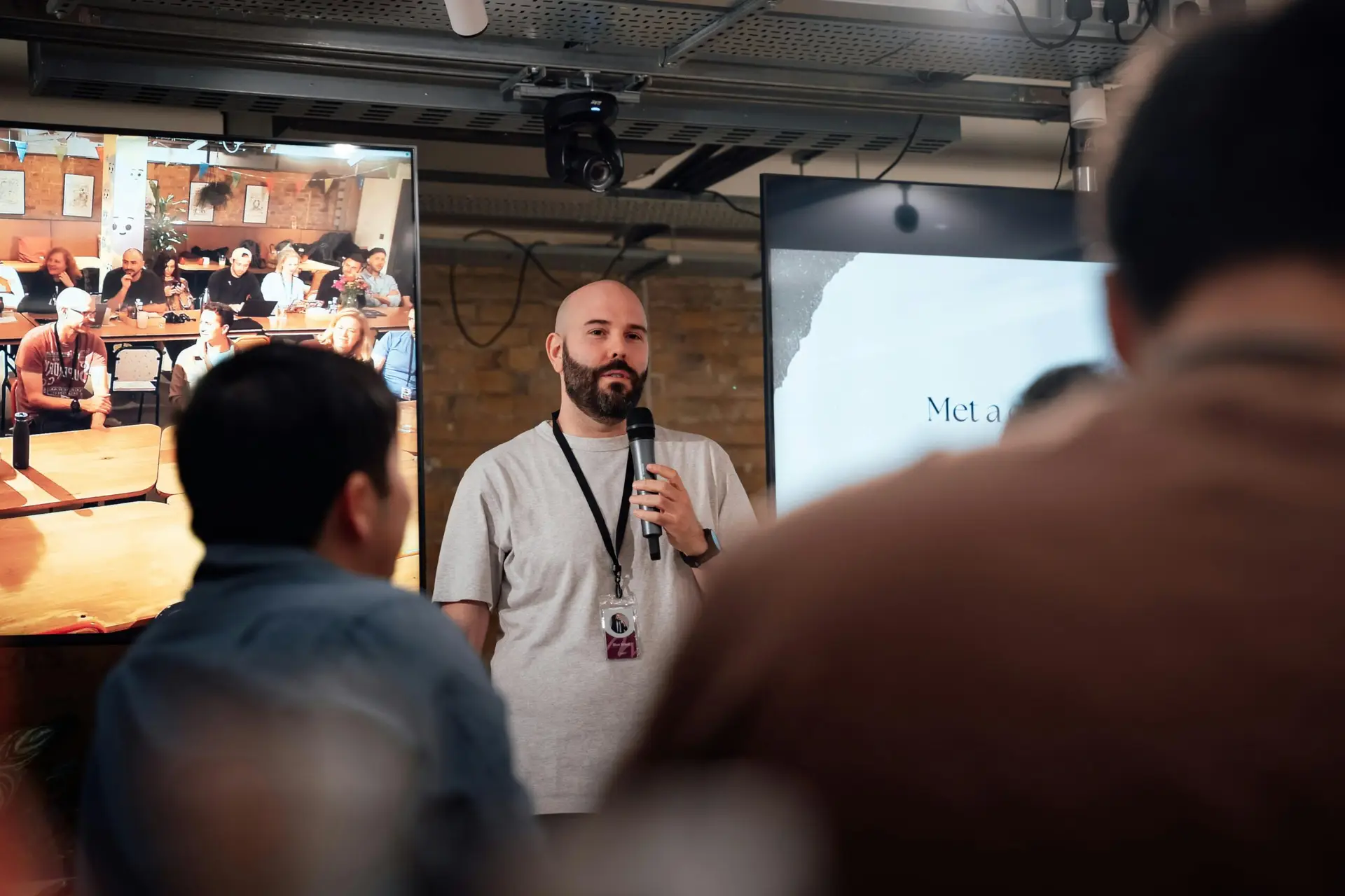 Speaker addressing audience at a London event. Engaging and informative session.